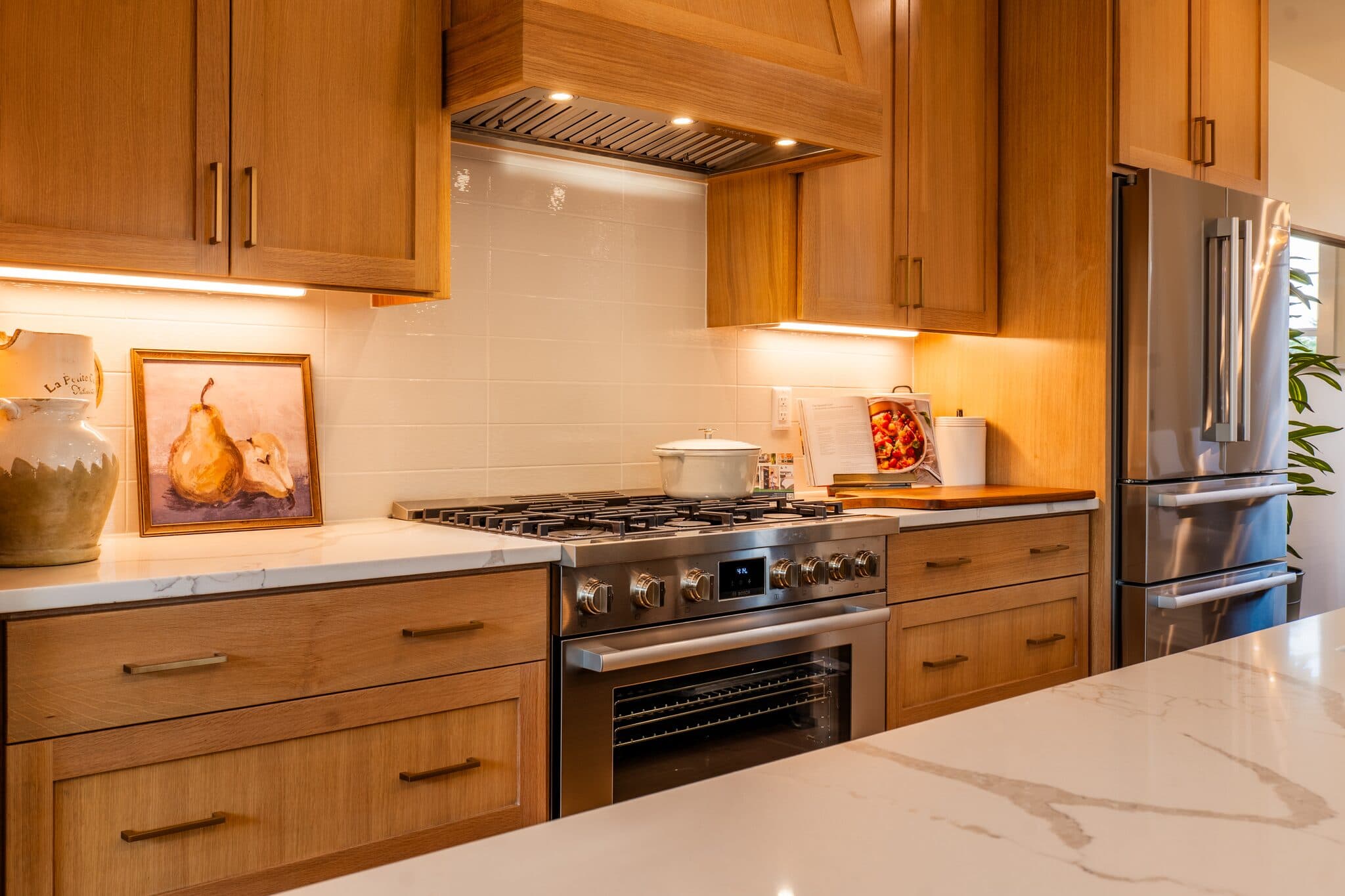 Kitchen with stainless range and marble counters — real estate photography by Hahn Media, Oregon