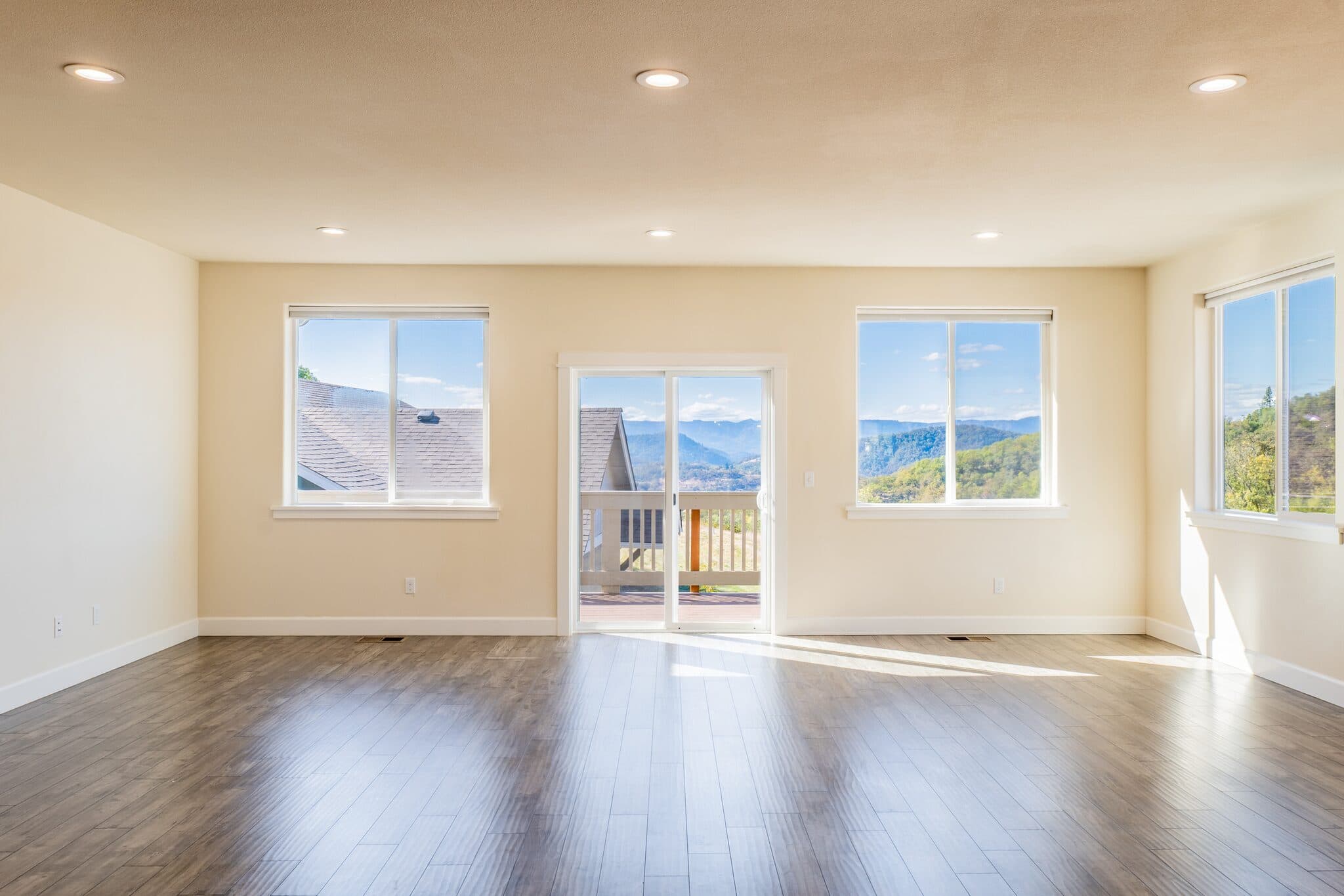Living area with sliding door and mountain views — real estate photography by Hahn Media, Oregon