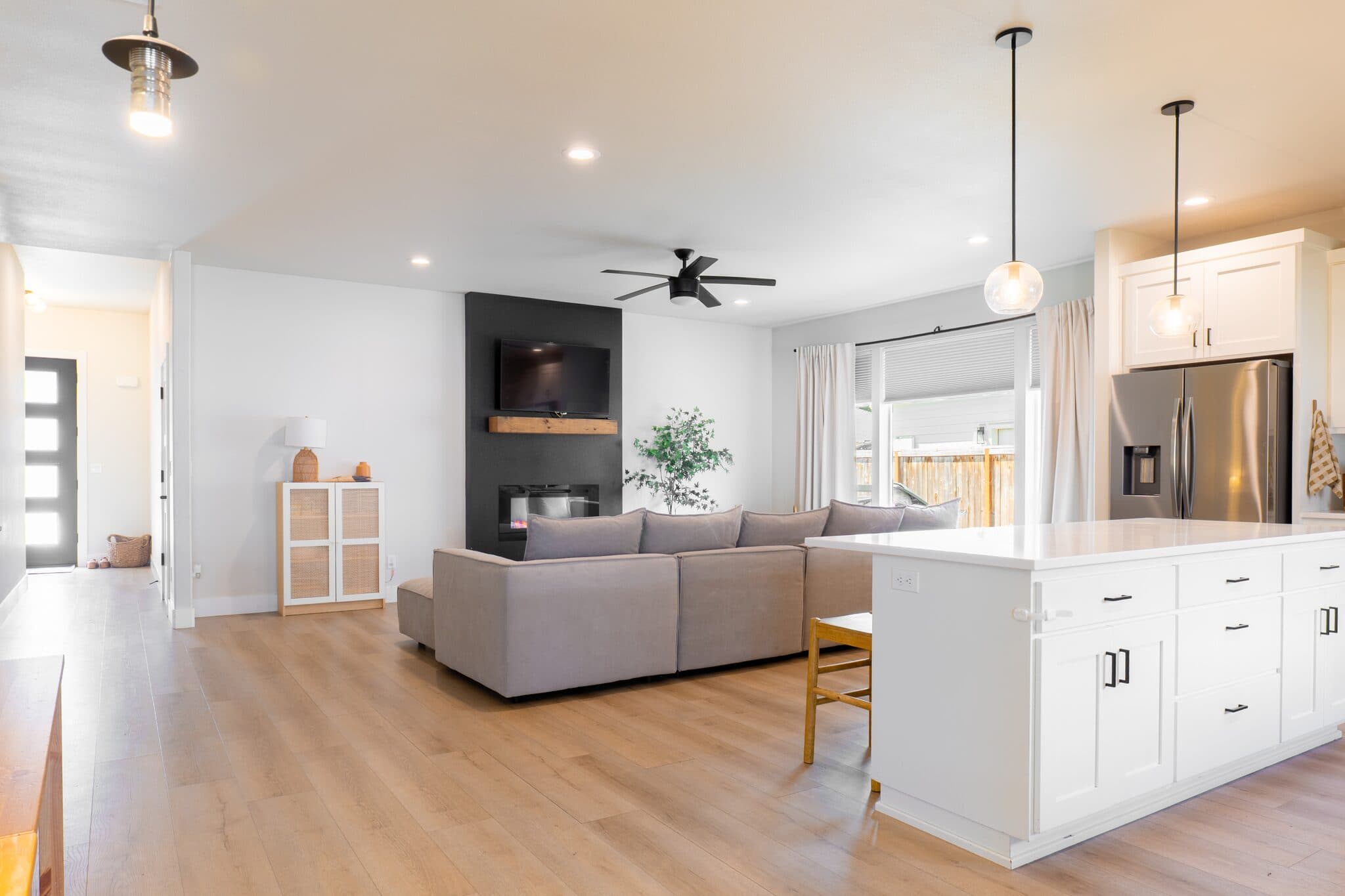Great room with kitchen, dining, and living area — real estate photography by Hahn Media, Oregon